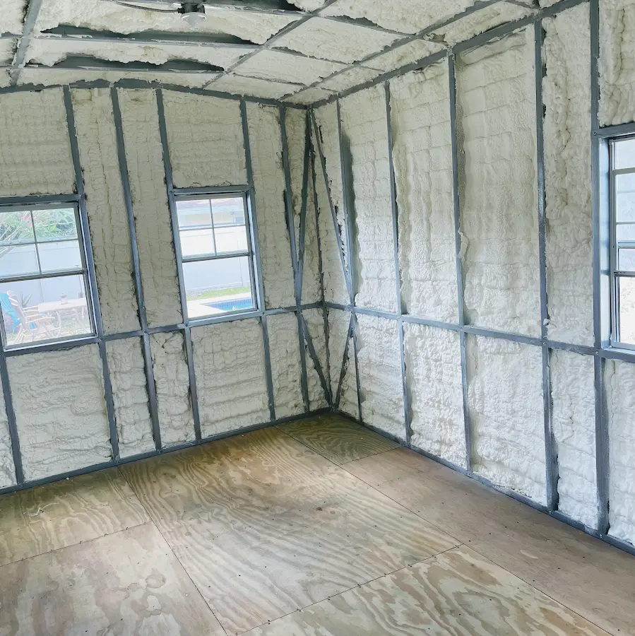 Closed-cell spray foam insulation applied to wall cavities in a residential project in Burlington