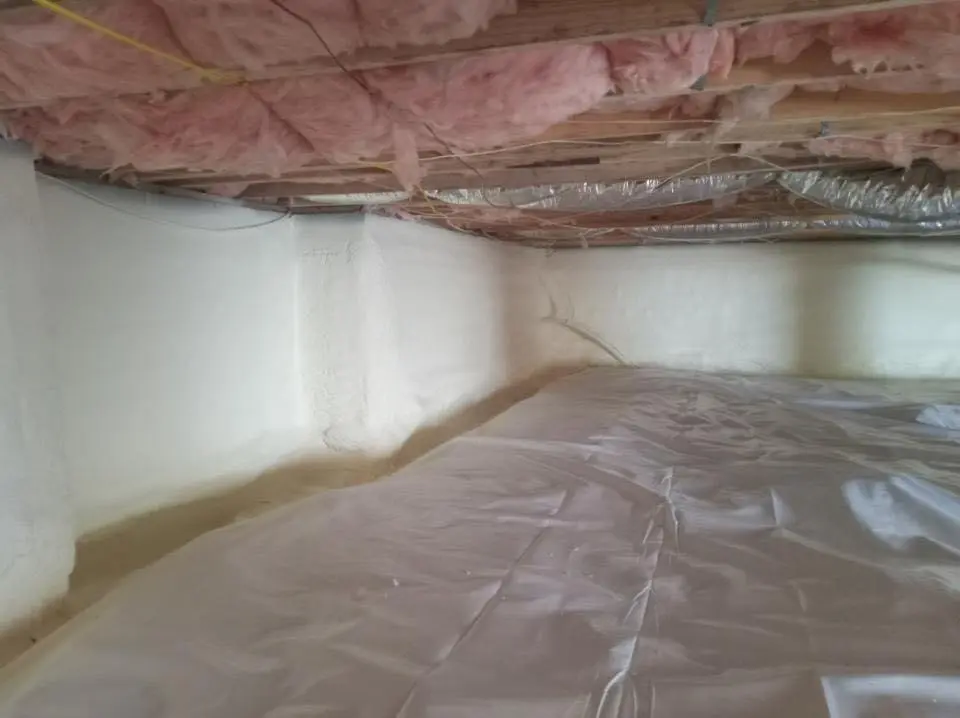 Crawl space encapsulation with closed-cell spray foam for Storm Damage Roof Repair in Burlington